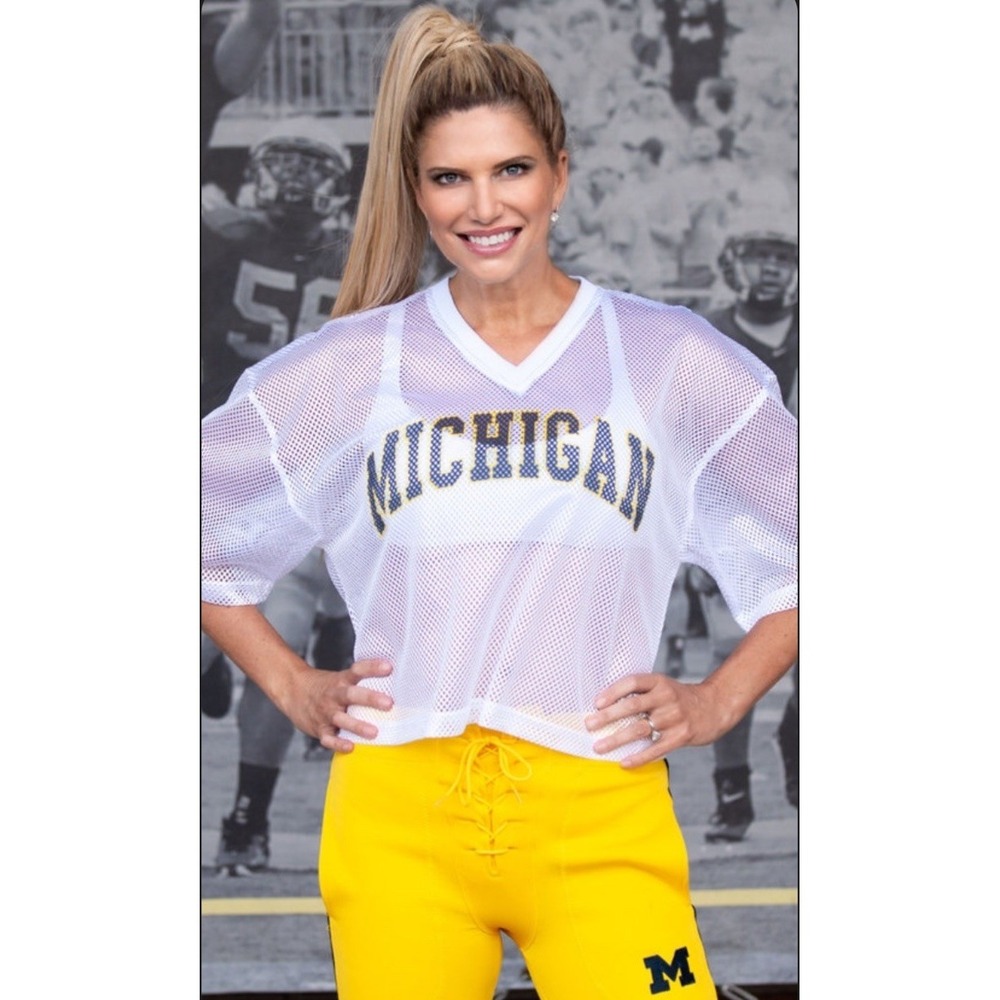 Michigan Wolverines jersey. It is a mesh-style top featuring the word MI. SZ-L/W